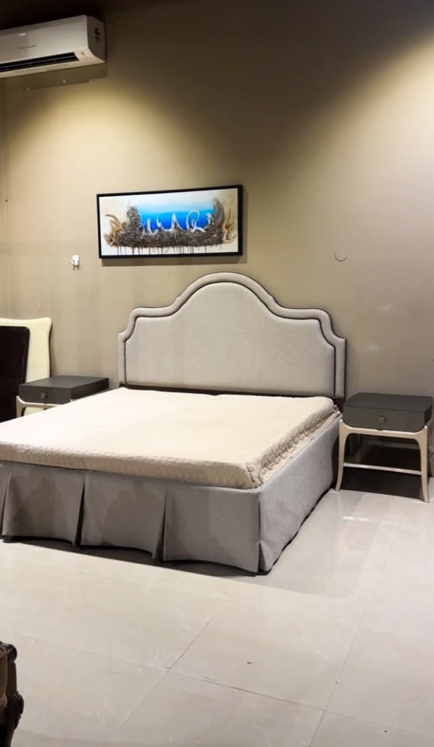 White Tufted Showroom Bed